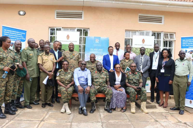 Dr. Fred Magala – MUWRP’s PEPFAR Program Director seated – 2nd left with the team that attended the launch of the UPDF’s HIV/AIDS strategic plan and the handover of the vehicle