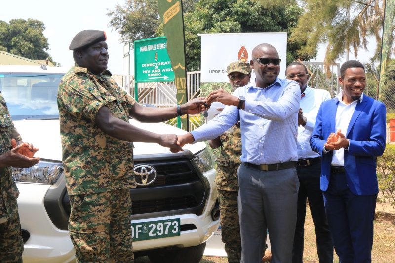 Dr. Fred Magala handing over the car keys to Brig. General Patrick Ocen